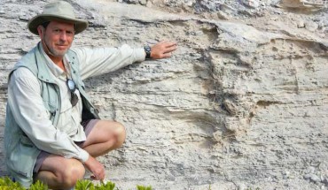 Professor Martin next to the Pleistocene iguana burrow. Image credit: Melissa Hage.