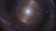 This Hubble image shows the central region of NGC 2217, a barred spiral galaxy some 83 million light-years away in the constellation Canis Major. This image is made up of observations from Hubble’s Advanced Camera for Surveys (ACS) in the optical part of the spectrum. It was colorized with data from the Panoramic Survey Telescope and Rapid Response System (Pan-STARRS). Image credit: NASA / ESA / Hubble / J. Dalcanton / Judy Schmidt, www.geckzilla.com.