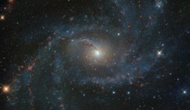 This Hubble image shows the spiral arms and various stellar environments of NGC 6946. The color image was made from separate exposures taken in the infrared region of the spectrum with Hubble’s Wide Field Camera 3 (WFC3). Three filters were used to sample various wavelengths. Image credit: NASA / ESA / Hubble / A. Leroy / K.S. Long.