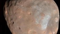 The High Resolution Imaging Science Experiment (HiRISE) camera on NASA’s Mars Reconnaissance Orbiter captured this image of the larger of Mars’ two moons, Phobos, on March 23, 2008. The image was taken from a distance of about 6,800 km (about 4,200 miles). It is presented in color by combining data from the camera’s blue-green, red, and near-infrared channels. The illuminated part of Phobos seen in the image is about 21 km (13 miles) across. The most prominent feature is the large crater Stickney in the lower right. With a diameter of 9 km (5.6 miles), it is the largest feature on Phobos. Image credit: NASA / JPL-Caltech / University of Arizona.
