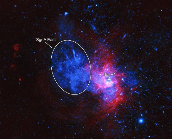 This composite image contains data from NASA’s Chandra X-ray Observatory (blue) and the NSF’s Very Large Array (red) of Sgr A East. This object is located very close to the supermassive black hole in the Milky Way’s center, and likely overruns the disk of material surrounding the black hole. Image credit: NASA / CXC / Nanjing University / Zhou et al. / NSF / NRAO / VLA.