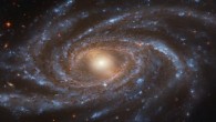 This Hubble image shows NGC 2336, a barred spiral galaxy located 109 million light-years away in the constellation of Camelopardalis. The color image was made from separate exposures taken in the visible and near-infrared regions of the spectrum with Hubble’s Advanced Camera for Surveys (ACS). Three filters were used to sample various wavelengths. The color results from assigning different hues to each monochromatic image associated with an individual filter. Image credit: NASA / ESA / Hubble / V. Antoniou / Judy Schmidt.