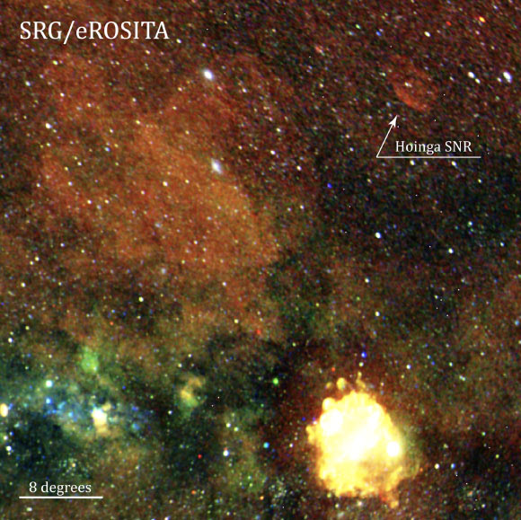 This image from the SRG/eROSITA all-sky survey shows SNR Hoinga (marked); the large bright source in the lower quadrant of the image is from SNR Vela; the image colors are correlated with the energies of the detected X-ray photons; red represents the 0.3-0.6 keV energy range, green 0.6-1.0 keV and blue 1.0-2.3 keV. Image credit: SRG / eROSITA / Becker et al., doi: 10.1051/0004-6361/202040156.