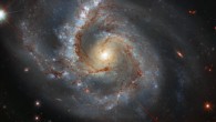 This Hubble image shows Arp 28, a bright barred spiral galaxy some 145 million light-years away in the constellation Pegasus. Image credit: NASA / ESA / Hubble / A. Riess et al.