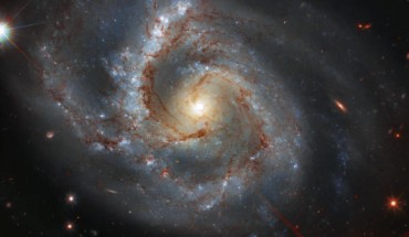 This Hubble image shows Arp 28, a bright barred spiral galaxy some 145 million light-years away in the constellation Pegasus. Image credit: NASA / ESA / Hubble / A. Riess et al.