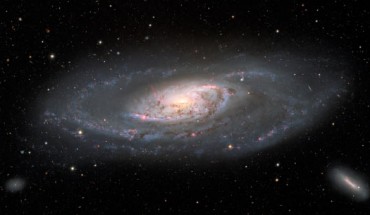 This image, taken with the Nicholas U. Mayall 4-m telescope, shows the spiral galaxy Messier 106. Two dwarf galaxies also appear in the image: NGC 4248 in the lower right and UGC 7356 in the lower left. Image credit: KPNO / NOIRLab / NSF / AURA / M.T. Patterson, New Mexico State University / T.A. Rector, University of Alaska Anchorage / M. Zamani & D. de Martin.
