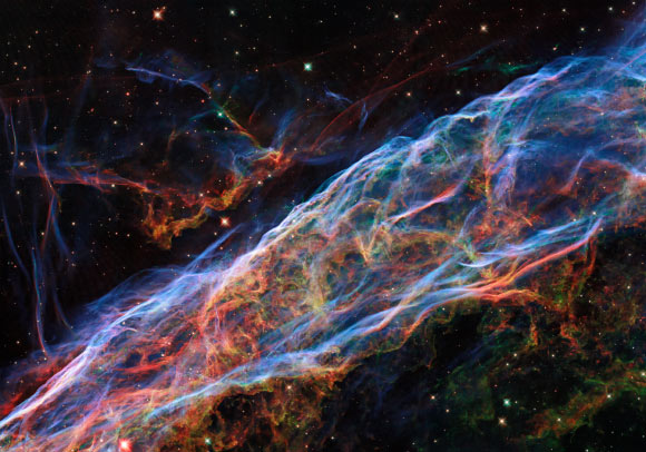 This Hubble image shows a small portion of the Veil Nebula, which is located 2,400 light-years away in the constellation of Cygnus. Image credit: NASA / ESA / Hubble / Z. Levay.