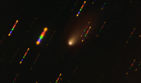 This image was taken with the FORS2 instrument on ESO’s Very Large Telescope in 2019, when comet 2I/Borisov passed near the Sun. Since the comet was traveling at breakneck speed, around 175,000 kmh (108,740 mph), the background stars appeared as streaks of light as the telescope followed the comet’s trajectory. The colors in these streaks give the image some disco flair and are the result of combining observations in different wavelength bands, highlighted by the various colors in this composite image. Image credit: ESO / O. Hainaut.