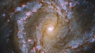 This composite image shows the barred spiral galaxy Messier 61. The color image is made up of observations from the Wide Field Camera 3 (WFC3) instrument onboard the NASA/ESA Hubble Space Telescope and the FOcal Reducer and low dispersion Spectrograph 2 (FORS2) instrument on ESO’s Very Large Telescope at Paranal Observatory in Chile in the near-infrared and optical parts of the spectrum. It is based on data obtained through six filters. The color results from assigning different hues to each monochromatic image associated with an individual filter. Image credit: NASA / ESA / Hubble / ESO / J. Lee / PHANGS-HST Team.