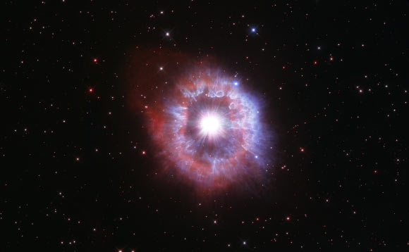 This Hubble image shows AG Carinae, a luminous blue variable star some 20,000 light-years away in the constellation of Carinae. The color image was made from separate exposures taken in the visible and ultraviolet regions of the spectrum with Hubble’s Wide Field Camera 3 (WFC3) instrument. Four filters were used to sample various wavelengths. The color results from assigning different hues to each monochromatic image associated with an individual filter. Image credit: NASA / ESA / STScI.
