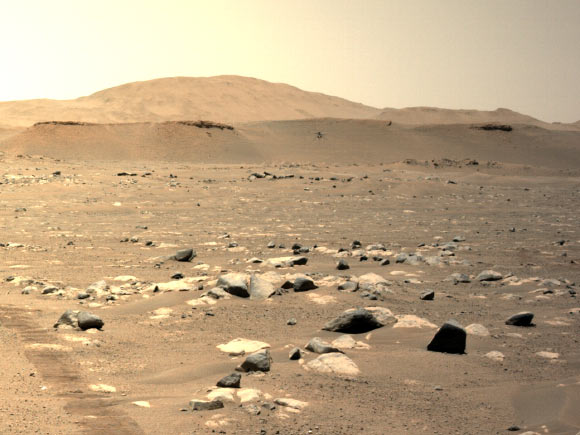 NASA’s Ingenuity helicopter can be seen hovering during its third flight on April 25, 2021, as seen by the left Navigation Camera aboard the Perseverance rover. Image credit: NASA / JPL-Caltech.