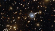This image, taken by the NASA/ESA Hubble Space Telescope, shows the massive galaxy cluster ACO S 295. The image is made up of observations from Hubble’s Wide Field Camera 3 (WFC3) and Advanced Camera for Surveys (ACS) instruments in the infrared and optical parts of the spectrum. Seven filters were used to sample various wavelengths. The color results from assigning different hues to each monochromatic image associated with an individual filter. Image credit: NASA / ESA / Hubble / F. Pacaud / D. Coe.