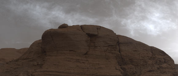 Curiosity captured these clouds just after sunset on March 19, 2021, the 3,063rd Martian day, or sol, of the rover’s mission. The image is made up of 21 individual images stitched together and color corrected so that the scene appears as it would to the human eye. Image credit: NASA / JPL-Caltech / MSSS.