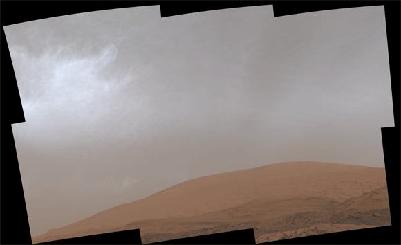 This animated image shows clouds drifting over Mount Sharp on Mars, as viewed by Curiosity on March 19, 2021. Each frame of the scene was stitched together from six individual images. Image credit: NASA / JPL-Caltech / MSSS.