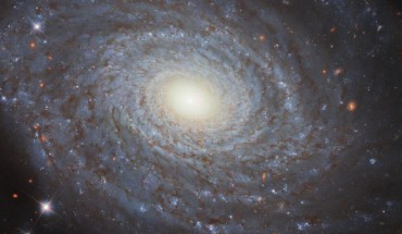 This Hubble image shows the spiral galaxy NGC 691. The image includes optical and infrared observations from Hubble’s Wide Field Camera 3 (WFC3) instrument. Four filters were used to sample various wavelengths. The color results from assigning different hues to each monochromatic image associated with an individual filter. Image credit: NASA / ESA / Hubble / A. Riess / M. Zamani.