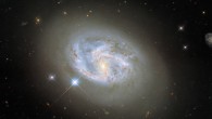 This Hubble image shows the spiral galaxy NGC 4680. The color image was made from separate exposures taken in the visible and infrared regions of the spectrum with Hubble’s Wide Field Camera 3 (WFC3). Four filters were used to sample various wavelengths. The color results from assigning different hues to each monochromatic image associated with an individual filter. Image credit: NASA / ESA / Hubble / Riess et al.