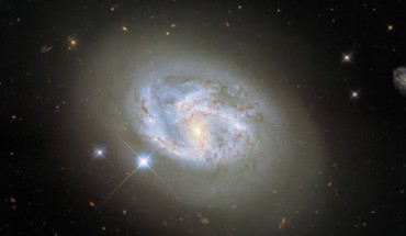 This Hubble image shows the spiral galaxy NGC 4680. The color image was made from separate exposures taken in the visible and infrared regions of the spectrum with Hubble’s Wide Field Camera 3 (WFC3). Four filters were used to sample various wavelengths. The color results from assigning different hues to each monochromatic image associated with an individual filter. Image credit: NASA / ESA / Hubble / Riess et al.