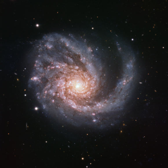 This image, taken by the FORS2 instrument on ESO’s Very Large Telescope, shows the grand design spiral galaxy Messier 99. It is based on data obtained through four filters. The color results from assigning different hues to each monochromatic image associated with an individual filter. Image credit: ESO.