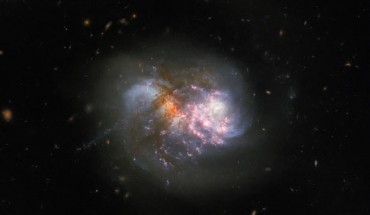 This Hubble image shows the interacting galaxy system IC 1623. The color image is made up of observations from Hubble’s Wide Field Camera 3 (WFC3) in the ultraviolet, infrared, and optical parts of the spectrum. It is based on data obtained through eight filters. The color results from assigning different hues to each monochromatic image associated with an individual filter. Image credit: NASA / ESA / Hubble / R. Chandar.