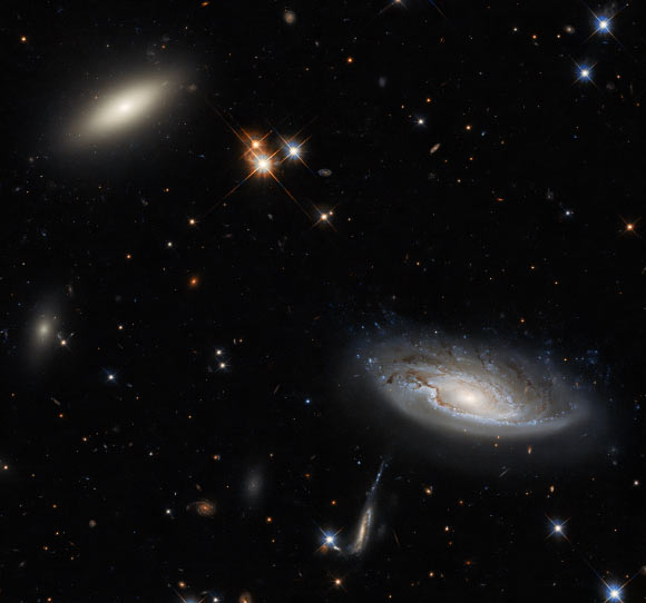 This Hubble image shows two galaxies, 2MASX J03193743+4137580 (left) and UGC 2665 (right), in the Perseus cluster. Image credit: NASA / ESA / Hubble / W. Harris / L. Shatz.