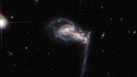 This Hubble image shows the triple galaxy system Arp 195. Image credit: NASA / ESA / Hubble / J. Dalcanton.