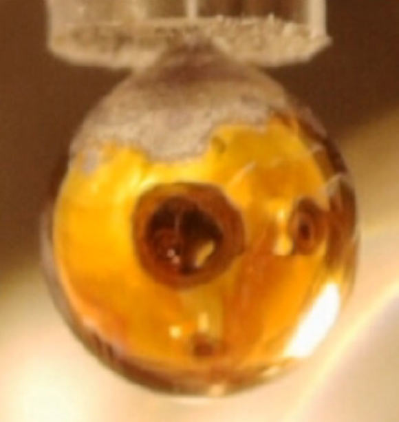 A pure NaK drop exposed to water vapor in vacuum. Image credit: Mason et al., doi: 10.1038/s41586-021-03646-5.