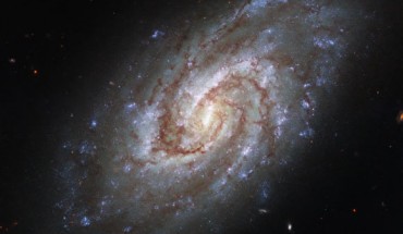 This Hubble image shows IC 1954, a spiral galaxy some 45 million light-years away in the constellation of Horologium. Image credit: NASA / ESA / Hubble / J. Lee / PHANGS-HST Team.