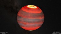 Jupiter is shown in visible light for context underneath an artistic impression of the Jovian upper atmosphere’s infrared glow. The brightness of this upper atmosphere layer corresponds to temperatures, from hot to cold, in this order: white, yellow, bright red and lastly, dark red. The aurorae are the hottest regions and the image shows how heat may be carried by winds away from the aurora and cause planet-wide heating. Image credit: J. O’Donoghue, JAXA / Hubble / NASA / ESA / A. Simon / J. Schmidt.