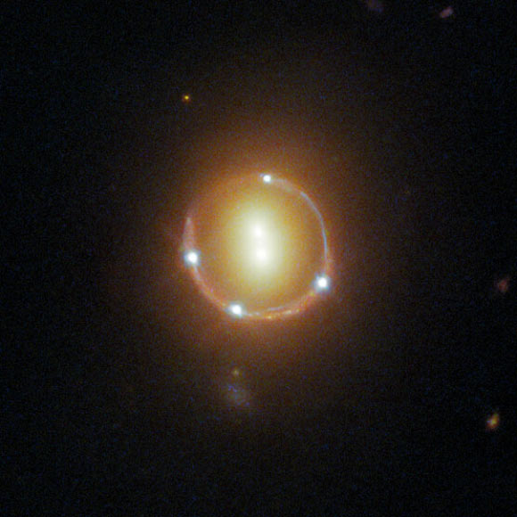 An Einstein ring formed by gravitationally lensed light from 2M1310-1714. Image credit: NASA / ESA / Hubble / T. Treu / Judy Schmidt, www.geckzilla.com.