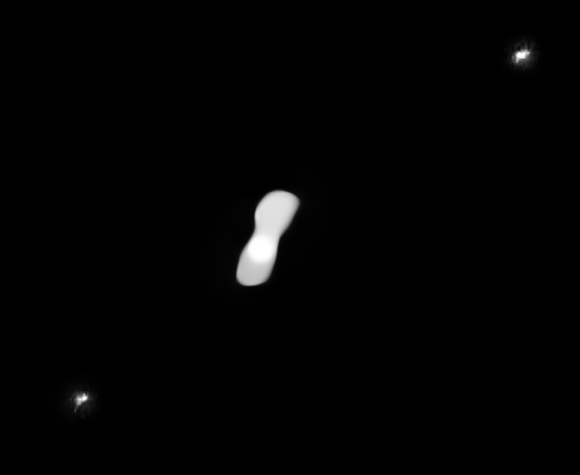This processed image, based on observations taken in July 2017, shows the two moons of the asteroid Kleopatra and its two moons, AlexHelios and CleoSelene. The moons are difficult to see in the raw images -- which were taken with the SPHERE instrument on VLT -- owing to glare around the asteroid, inherent to this kind of adaptive-optics observations. Image credit: ESO / Vernazza / Marchis et al. / MISTRAL algorithm / ONERA / CNRS.