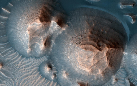 This image, acquired by NASA’s Mars Reconnaissance Orbiter on October 1, 2020, shows several craters in Arabia Terra filled with layered rock. Image credit: NASA / Molly Wasser.