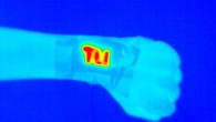 An electrically conductive and durable yarn was sewn onto fabric and became a wearable heater (high temperatures indicated by yellows and reds) when a safe voltage was applied. Image credit: Pattanarat et al., doi: 10.1021/acsami.1c13329.