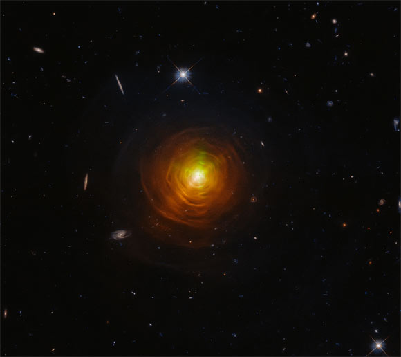 This Hubble image shows the carbon star CW Leonis. The image incorporates observations from 2011 and 2016 by Hubble’s Wide Field Camera 3 (WFC3). The star is brightest in the red filters, R and I, and therefore the simmering orange color pervading the center of the image well represents the real color of the star. Image credit: NASA / ESA / Hubble / T. Ueta / H. Kim.