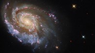 This Hubble image shows NGC 6984, a barred spiral galaxy some 164 million light-years away in the constellation of Indus. The color image is made up of observations from Hubble’s Wide Field Camera 3 (WFC3) in the ultraviolet, near-infrared, and optical parts of the spectrum. Six filters were used to sample various wavelengths. The color results from assigning different hues to each monochromatic image associated with an individual filter. Image credit: NASA / ESA / Hubble / D. Milisavljevic.