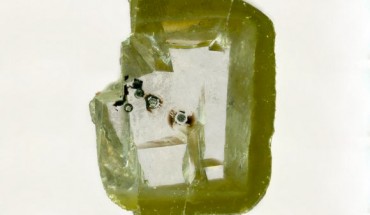This diamond from Botswana contains tiny inclusions of davemaoite. Image credit: Aaron Celestian, Natural History Museum of Los Angeles County.