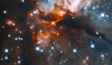 This Hubble image shows G035.20-0.74, a star-forming nebula located 7,143 light-years away in the constellation of Aquila. Image credit: NASA / ESA / J. Tan, Chalmers University of Technology / Gladys Kober, NASA & Catholic University of America.