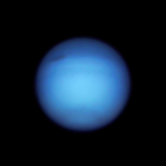 Neptune’s dark spot, which recently was found to have reversed course from moving toward the equator, is visible in this Hubble image. Image credit: NASA / ESA / Hubble / Amy Simon, NASA’s Goddard Space Flight Center / Michael H. Wong, University of California, Berkeley / Alyssa Pagan, STScI.