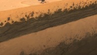 This artist’s impression shows NASA’s InSight lander in Homestead Hollow, a small impact crater; the r SEIS seismometer is the light-colored hemisphere on the ground in front of the lander; the ground beneath it consists of a sandy regolith layer on top of alternate layers of sediments (yellow-orange colors) and basaltic rocks, i.e. former lava flows (brown colors). Image credit: Géraldine Zenhäusern / ETH Zürich.