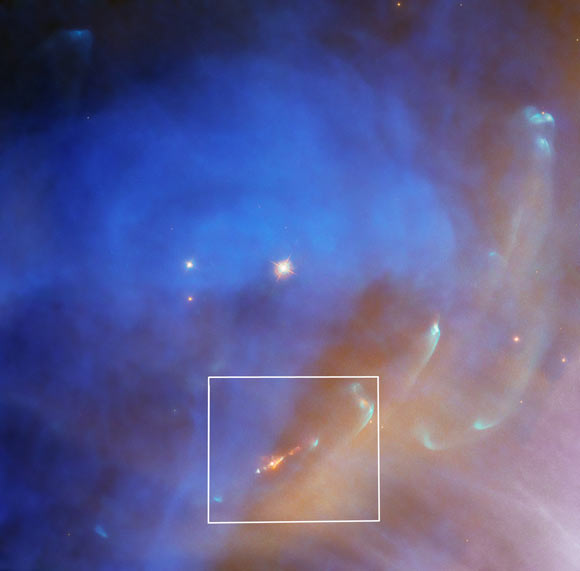 Hubble captured a bright jet  (orange object at the bottom center of the image) from the protostar Parengo 2042 in this image of NGC 1977. Image credit: NASA / ESA / Hubble / J. Bally, University of Colorado at Boulder / Gladys Kober, NASA & Catholic University of America.