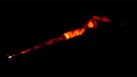 VLA image of the Messier 87 radio jet, made at multiple radio frequencies. The jet seen in this image is about 8,000 light-years long. This image clearly shows the corkscrew-like helical structure in the inner part of the jet, which originates at the bright spot at the left, at the core of the galaxy, where a supermassive black hole resides. Image credit: Sophia Dagnello / NRAO / AUI / NSF / Pasetto et al., doi: 10.3847/2041-8213/ac3a88.