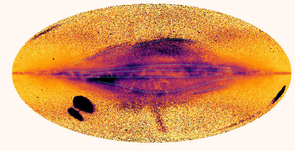 All-sky map of the Milky Way in motion using the Gaia data. Areas with significant motion are shown in black/purple and those with relatively low motion in yellow. A number of large scale filamentary disc structures are evident about the midplane. The map also shows the Magellanic Clouds and their connecting stellar bridge to left, while the Sagittarius dwarf galaxy currently being torn apart can be seen on the right (main body). Image credit: Laporte et al., doi: 10.1093/mnrasl/slab109.
