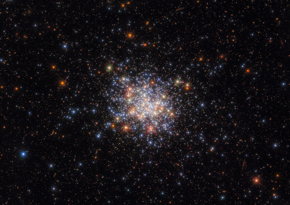 This Hubble image shows NGC 1755, an open star cluster some 160,000 light-years away in the southern constellation of Dorado. The color image was made from separate exposures taken in the ultraviolet, visible and near-infrared regions of the spectrum with Hubble’s Advanced Camera for Surveys (ACS) and Wide Field Camera 3 (WFC3). Three filters were used to sample various wavelengths. The color results from assigning different hues to each monochromatic image associated with an individual filter. Image credit: NASA / ESA / Hubble / A. Milone / G. Gilmore.
