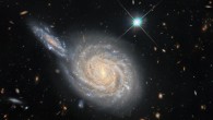This image, taken with the NASA/ESA Hubble Space Telescope, depicts NGC 105, a spiral galaxy 215.5 million light-years away in the constellation of Pisces, and a smaller distant galaxy. Image credit: NASA / ESA / Hubble / D. Jones / Riess et al. / R. Colombari.