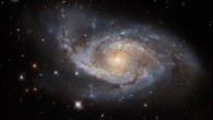 This image shows NGC 3318, a barred spiral galaxy some 115 million light-years away in the constellation of Vela. The color image is made up of observations from Hubble’s Wide Field Camera 3 (WFC3) and VLT’s Multi Unit Spectroscopic Explorer (MUSE) instrument in the near-infrared and optical parts of the spectrum. Six filters were used to sample various wavelengths. The color results from assigning different hues to each monochromatic image associated with an individual filter. Image credit: NASA / ESA / Hubble / ESO / R.J. Foley / R. Colombari.