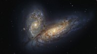 This image shows two spiral galaxies: NGC 4567 (left) and NGC 4568 (right). The color image was made from separate exposures taken in the visible and near-infrared regions of the spectrum with the FORS2 instrument on ESO’s Very Large Telescope. It is based on data obtained through four filters. The color results from assigning different hues to each monochromatic image associated with an individual filter. Image credit: ESO.