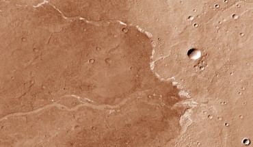 This image from the Context Camera onboard NASA’s Mars Reconnaissance Orbiter shows Bosporos Planum on Mars; the white specks are salt deposits found within a dry channel; the largest impact crater in the scene is nearly 1.5 km (one mile) across. Image credit: NASA / JPL-Caltech / MSSS.
