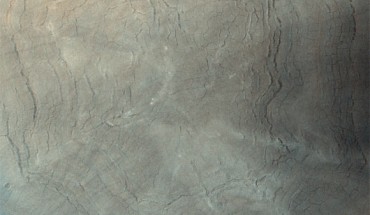 This image from ESA’s Trace Gas Orbiter shows a giant impact crater in Acidalia Planitia on Mars. Image credit: ESA / CaSSIS / CC BY-SA 3.0 IGO.