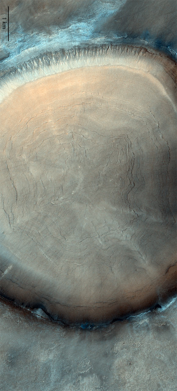 This image from ESA’s Trace Gas Orbiter shows a giant impact crater in Acidalia Planitia on Mars. Image credit: ESA / CaSSIS / CC BY-SA 3.0 IGO.