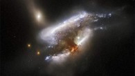This composite image shows the distant galaxy merger IC 2431. The image is composed of infrared, optical and ultraviolet observations from Hubble’s Advanced Camera for Surveys (ACS), the Dark Energy Camera (DECam) on the Victor M. Blanco 4-m Telescope, and the Sloan Digital Sky Survey (SDSS). Nine filters were used to sample various wavelengths. The color results from assigning different hues to each monochromatic image associated with an individual filter. Image credit: NASA / ESA / Hubble / W. Keel, Dark Energy Survey / DOE / FNAL / DECam / CTIO / NOIRLab / NSF / AURA / SDSS / Judy Schmidt, www.geckzilla.com.