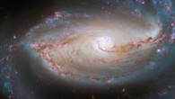 This Hubble image shows NGC 1097, a barred spiral galaxy some 48 million light-years away in the constellation of Fornax. The color image is made up of observations from Hubble’s Wide Field Camera 3 and Advanced Camera for Surveys in the ultraviolet, near-infrared, and optical parts of the spectrum. Seven filters were used to sample various wavelengths. The color results from assigning different hues to each monochromatic image associated with an individual filter. Image credit: NASA / ESA / Hubble / D. Sand / K. Sheth.